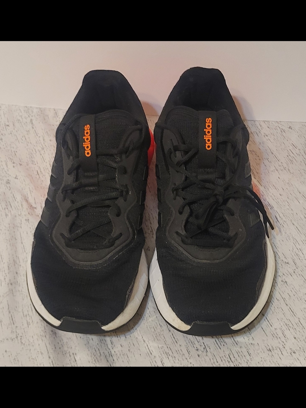 Adidas Black Athletic Shoes with Orange Accent